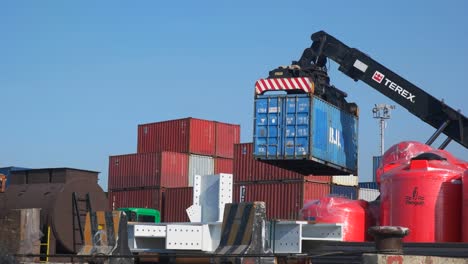 close-up-Reach-Stacker-moving-one-container-in-port