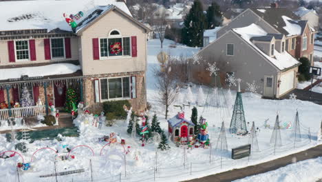 Winter-snow-with-decorated-Christmas-lights-at-home-neighborhood