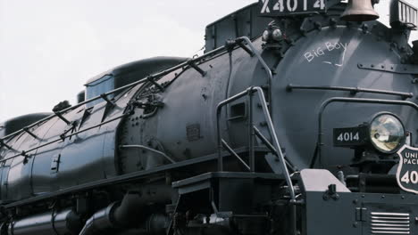Slow-pan-down-length-of-Union-Pacific's-Big-Boy-4014-steam-engine-at-train-show