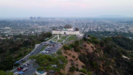 Aerial-view-around-the-Griffith-Observatory,-dusk-in-Los-Angeles,-California---circling,-drone-shot