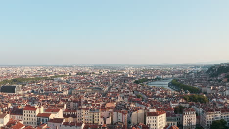 Rising-drone-shot-of-Central-Lyon-France-at-sunset
