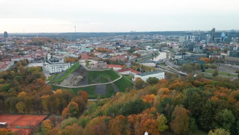 AERIAL:-Flying-Over-Three-Crosses-Hill-Towards-Gediminas-Castle-Hill-in-Autumn