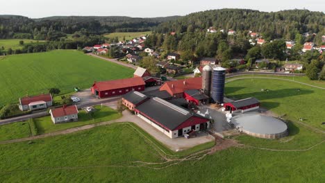 Aerial-Drone-Shot-of-a-Rural-Countryside-Dairy-Farm-near-Gothenburg,-Sweden
