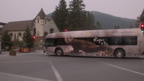 Electric-bus-passing-through-downtown-Banff