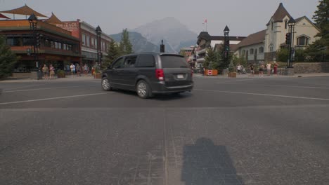 A-busy-cross-section-in-downtown-Banff-mid-road-Timelapse