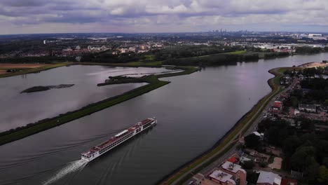 High-Aerial-View-Of-Viking-Ve-Cruise-Longship-Navigating-Along-River-Noord-Near-Hendrik-Ido-Ambacht
