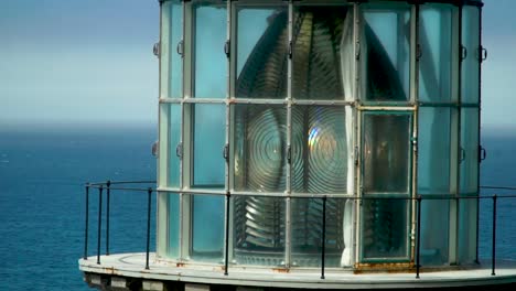 Close-up-view-a-lighthouse-flashing-light-to-warn-ships-of-danger-on-the-Oregon-Coast