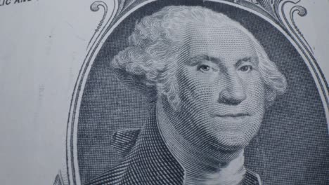 Close-Up-Pan-of-George-Washington-on-the-Front-of-a-US-One-Dollar-Bill