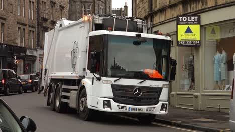 White-Mercedes-Benz-Econic-2630-garbage-truck-in-the-streets-of-Edinburgh,-Scotland