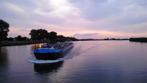 Forward-Bow-Of-Aviso-2-Inland-Motor-Tanker-Along-Oude-Maas-Against-Sunset-Skies