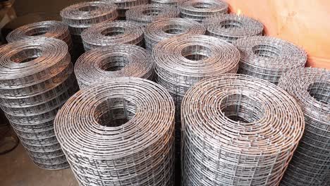 Stacked-Wire-Mesh-Rolls-On-Floor.-Circle-Dolly