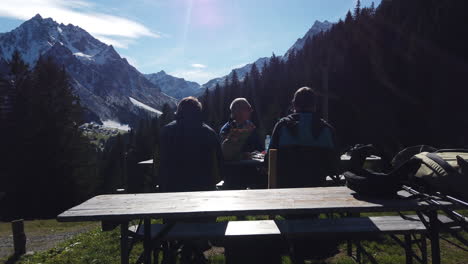 3-Austrian-men-resting-with-a-beautiful-Austrian-mountain-in-the-background