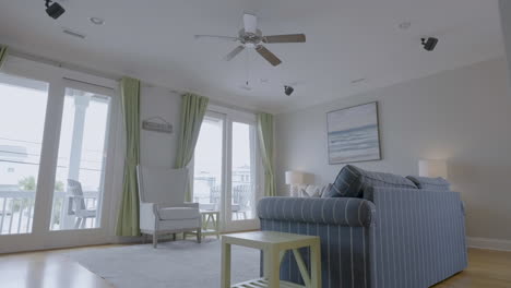 Modern-minimalistic-living-room-with-ceiling-fan-LOW-ANGLE-CRANE-UP