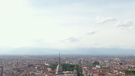 Turin-city-streets-and-majestic-skyline-on-beautiful-day,-aerial-tilting-down-view