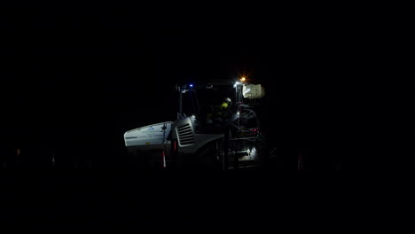 Static-View-Of-A-Road-Paver-Machine-On-A30-Road-In-Cornwall,-UK-At-Night