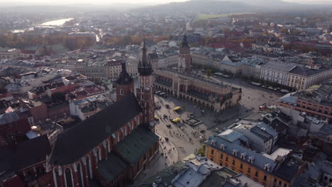 Stunning-Aerial-Approach-of-Krakow-Historic-Market-Square,-Golden-Hour