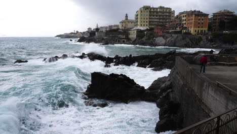 Swell-Hitting-Rocky-Coast-And-Seawall-Near-City-Of-Genoa,-Italy