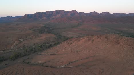 Aerial-wide-view-Dry-creek-on-arid-location,-Mountain-range-Wilpena-Pound,-Australia