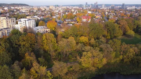 AERIAL-Descending-Fly-By-of-a-Suburban-Neighborhood-Žvėrynas-in-Vilnius-Lithuania-with-Autumn-Foliage-in-October