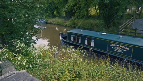 Canal-leisure-Narrowboat-barge-navigating-through-set-of-locks-on-Shropshire-Union-canal
