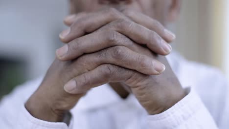 praying-to-god-with-hands-together-on-grey-background-stock-video-stock-footage