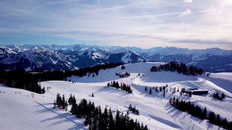 Aerial-view-smooth-movement-along-the-ski-slopes-in-the-ski-resort