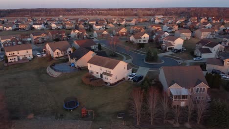 Private-home-district-during-warm-sunset,-aerial-drone-view