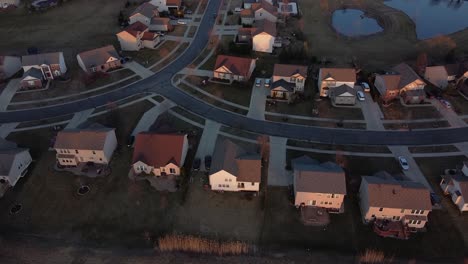Flat-Rock-township-with-private-housing-during-sunset,-aerial-view