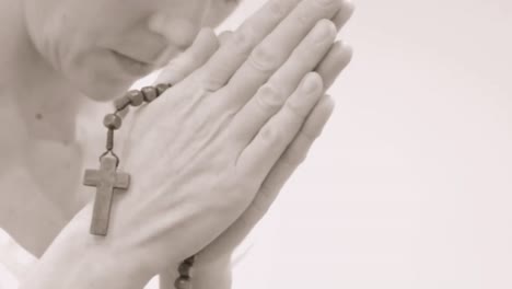 praying-to-God-with-hands-together-with-cross-stock-video-stock-footage
