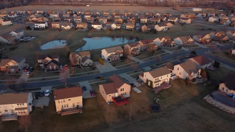 Rural-housing-development-during-sunset,-Michigan,-USA,-aerial-drone-view