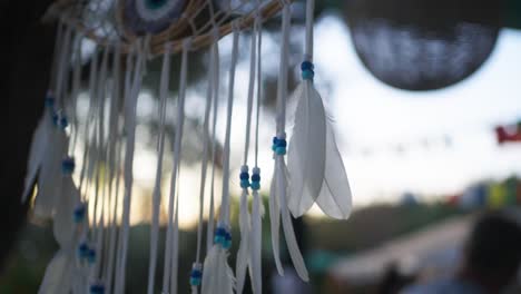 Close-up-shot-of-a-feather-eye-dreamcatcher-on-sale-in-Corfu,-Greece