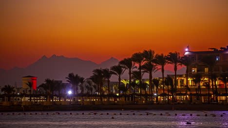 Sunset-on-a-breezy-evening-at-a-resort-hotel-in-Hurghada,-Egypt---time-lapse