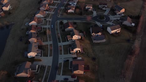 Iconic-American-housing-development-with-long-winding-street,-aerial-view