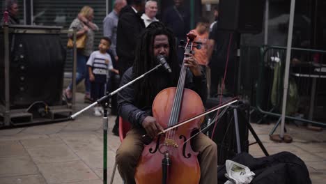 African-Man-Playing-Bass-On-Street