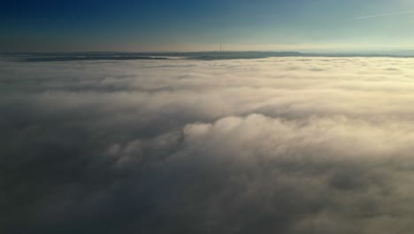 Religious,-Aerial-Drone-Scene-Above-Urban-townscape-areas-shrouded-In-morning-mist