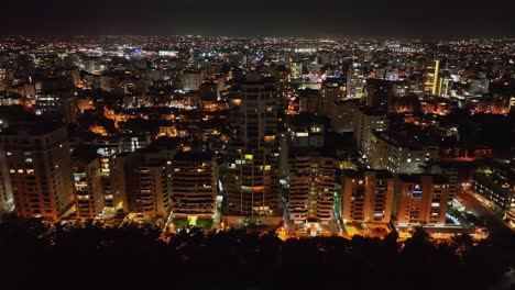 Skyscrapers-and-buildings-in-Avenida-Anacaona-at-night,-Santo-Domingo-city-in-Dominican-Republic