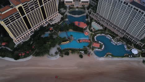 Aerial-view-of-Grand-Hotel-Ho-Tram,-Vietnam-featuring-buildings-and-swimming-pool