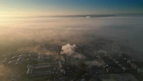 Dreamy-Winter-Aerial-Drone-SceneAbove-Industrial-Urban-townscape-areas-shrouded-In-morning-mist