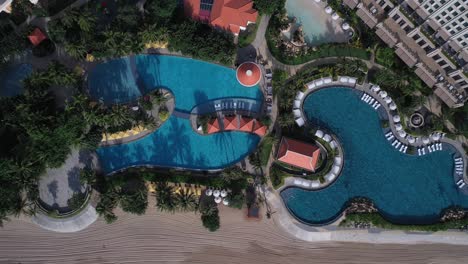 Grand-Hotel-Ho-Tram-top-down-aerial-view-featuring-buildings-and-swimming-pool