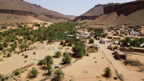 Famous-Mauritania-Village-in-Terjit-Oasis,-Sahara-Desert---Aerial-Flyover-Establishing-Drone-Flight