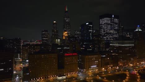 Aerial-view-around-the-Congress-Hotel-and-the-Loop-cityscape,-night-in-Chicago,-USA