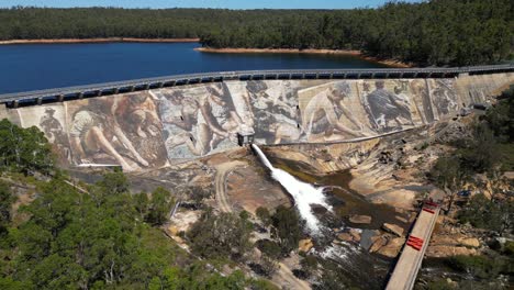 Tracking-aerial-of-giant-panoramic-mural-painted-on-active-dam-in-Western-Australia
