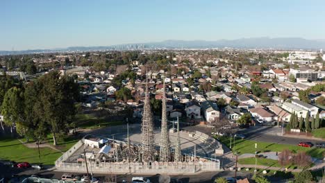 Aerial-push-in-and-tilting-down-shot-of-the-Watts-Towers-in-Los-Angeles,-California