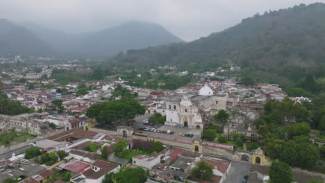 Fast-aerial-flyover-of-a-historical-cathedral-in-the-haze-in-Antigua,-Guatemala