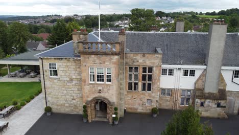 Cinematic-flight-from-left-to-right-over-Dalmeny-Park,-a-luxurious-Scottish-country-mansion