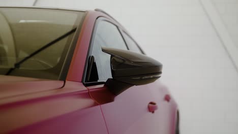 Side-view-of-a-car-while-the-side-rearview-mirror-pops-up