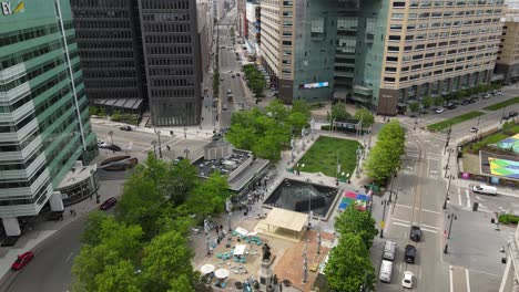 Small-Campus-Martius-park-surrounded-by-skyscrapers-of-Detroit,-aerial-drone-view
