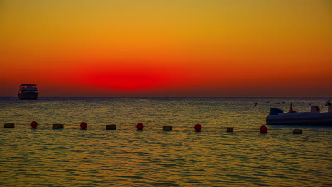 Exotic-tropical-vibrant-sunset-near-resort-coastline,-fusion-time-lapse