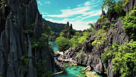 4k-Drone-Explores-Passages-in-Twin-Lagoon,-Coron,-Palawan-Philippines