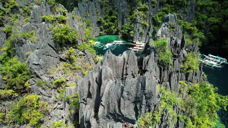 4k-Drone-Flys-over-Sharp-Karst-in-Twin-Lagoon,-Coron,-Palawan-Philippines